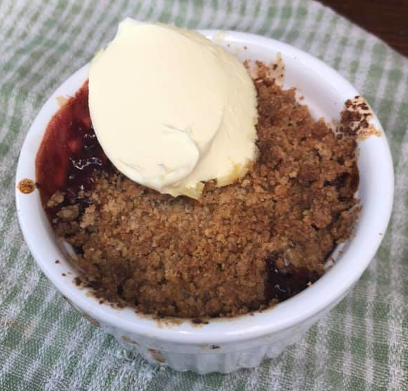 Wild foraged damson crumble with clotted cream